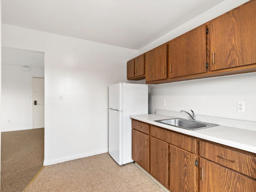 Kitchen with refrigerator